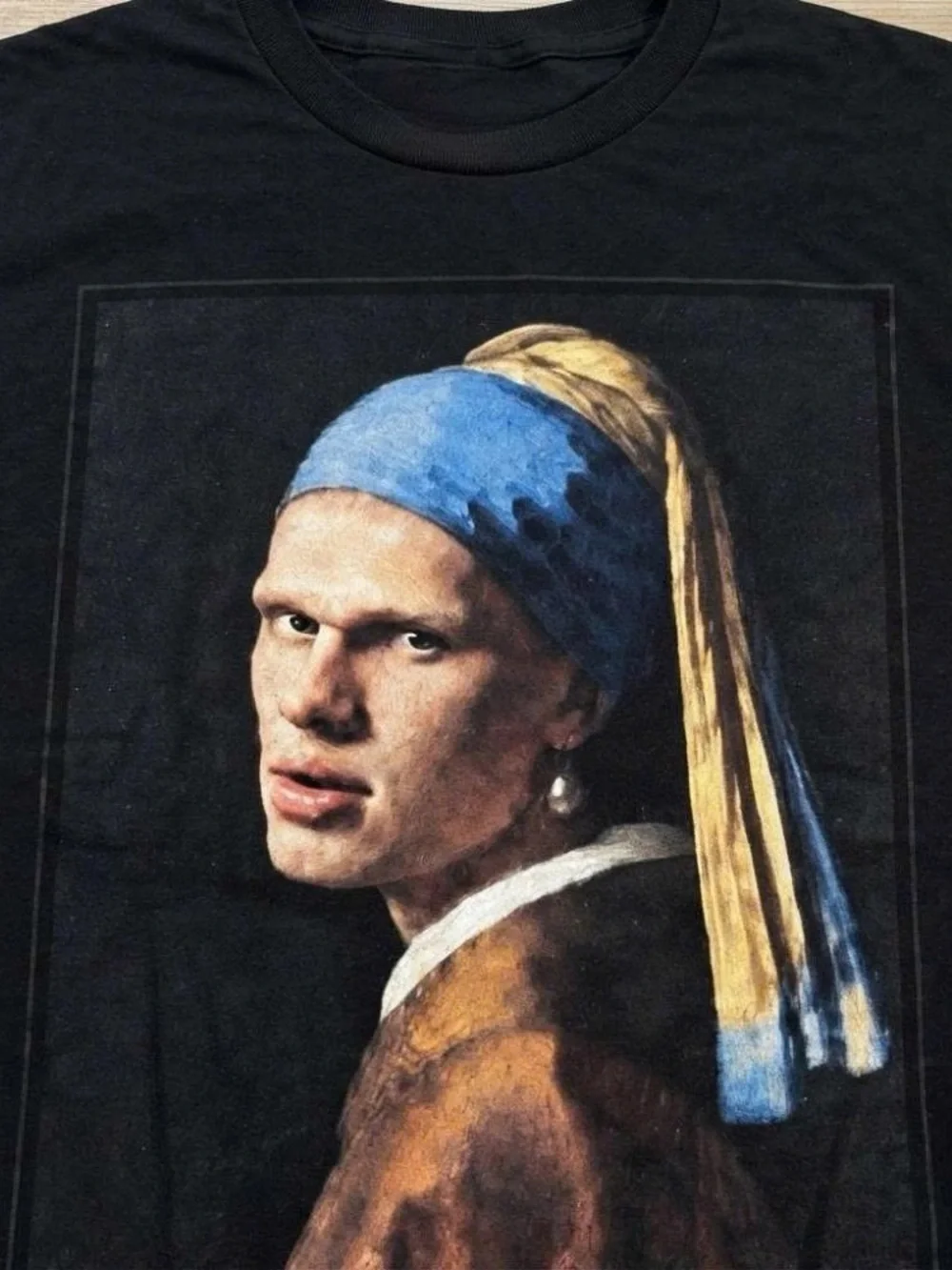 Black Graphic Tee with Blue and Gold Print
